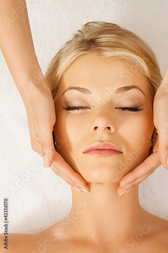 Photo: beautiful woman in massage salon beautiful woman in massage salon