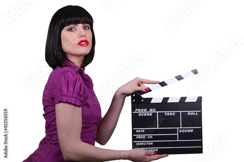 Foto: Sexy woman with cinema clap, studio shot Sexy woman with cinema clap, studio shot