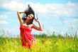 Foto: Happy beautiful woman dancing in meadow Happy beautiful woman dancing in meadow