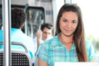 Brunette riding on tram