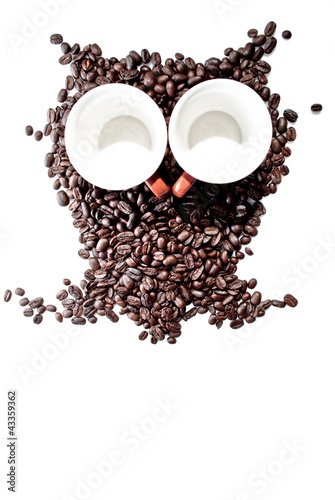 Photo: conteptual owl made with coffee beans conteptual owl made with coffee beans