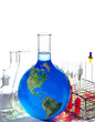 Beaker of blue liquid with globe pattern