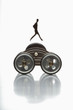 Foto: Figure of businessman balancing on toy vehicle Figure of businessman balancing on toy vehicle