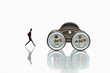 Foto: Figure of businessman following on toy vehicle Figure of businessman following on toy vehicle