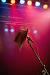 Photo: Fedora hanging on microphone on stage Fedora hanging on microphone on stage