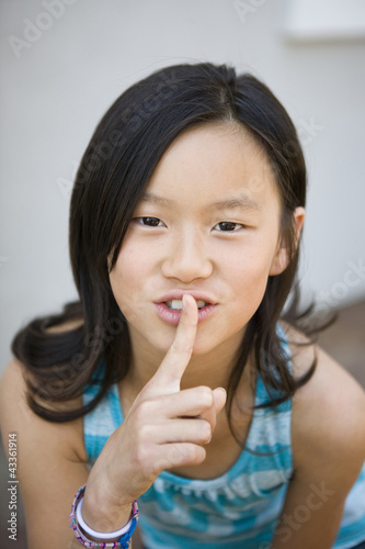 Photo: Chinese girl making shhh gesture Chinese girl making shhh gesture