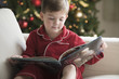 Caucasian boy reading Christmas story