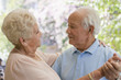 Senior Hispanic couple dancing together