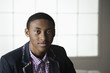 Mixed race teenager in colorful suit