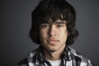 Serious Hispanic young man