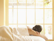 Rear view of woman lying on massage table at a luxury spa in wine country