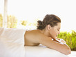 Photo: Smiling woman with eyes closed lying on massage table at luxury spa in Napa Valley California Smiling woman with eyes closed lying on massage table at luxury spa in Napa Valley California
