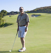 Caucasian man playing golf on golf course