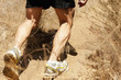 Hispanic man running on dirt road