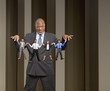 African American businessman holding string of small business people