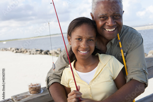 Photo: Black grandfather going fishing with granddaughter Black grandfather going fishing with granddaughter
