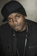 Serious Black man in baseball cap