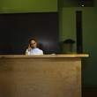Woman working at reception desk in office
