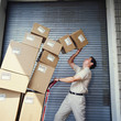 Boxes tipping on delivery man