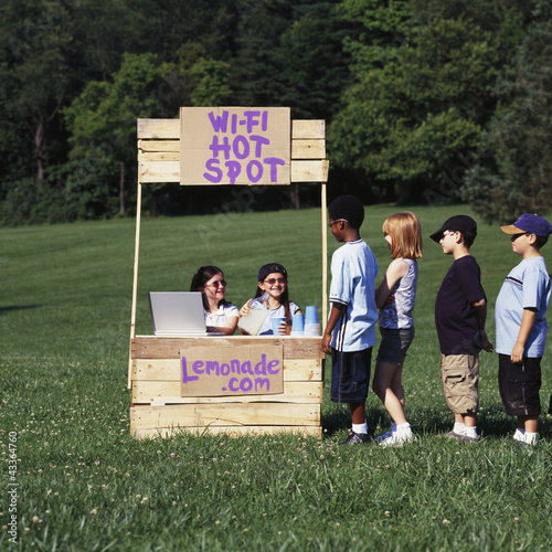 Photo: Children with wi-fi enabled lemonade stand Children with wi-fi enabled lemonade stand