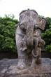 Stone statue of elephant carrying man