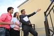 Estate agent with young couple