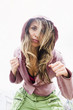 Hispanic woman leaning and making punching gesture