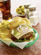 Pepperjack cheeseburger served with potato chips and soft drink