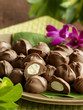 Filled chocolate candies served on plate