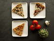 Slices of pizza served on plates, top view