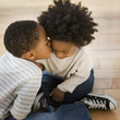 African American boy kissing brother