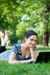 Beautiful young woman  using her laptop outdoors