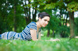 Beautiful young woman  using her laptop outdoors