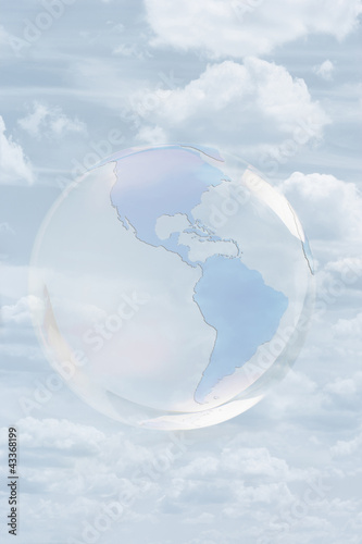 Photo: Transparent globe floating in sky Transparent globe floating in sky
