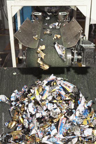 Photo: Shredded recycling coming off conveyor Shredded recycling coming off conveyor