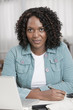 African American woman paying bills