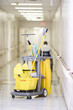 Janitorial cleaning cart in hospital corridor