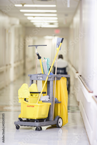 Photo: Janitorial cleaning cart in hospital corridor Janitorial cleaning cart in hospital corridor