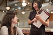 Waitress taking customer's order
