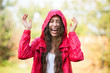 Foto: Joyful woman playing in rain Joyful woman playing in rain