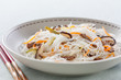 rice noodles with vegetables, mushrooms and meat