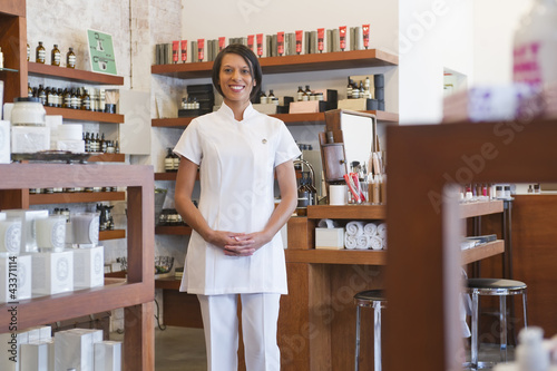 Photo: Aesthetician standing in beauty product store Aesthetician standing in beauty product store