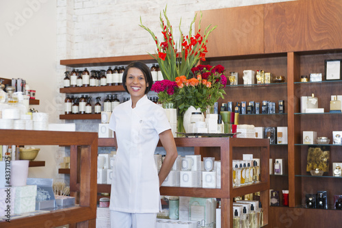 Photo: Aesthetician standing in beauty product store Aesthetician standing in beauty product store
