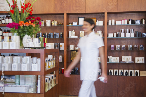 Photo: Aesthetician working in beauty product store Aesthetician working in beauty product store