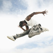 African American man jumping in mid-air