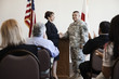 Politician greeting soldier at political gathering