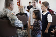 Children talking to soldier at political gathering