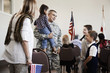 Children talking to soldier at political gathering