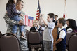 Children talking to soldier at political gathering