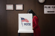 Asian voter voting in polling place